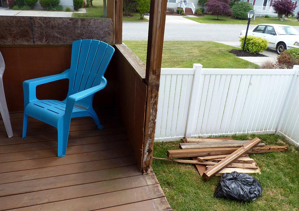 Rotted deck post and worn back porch on a Michigan home in need of replacement