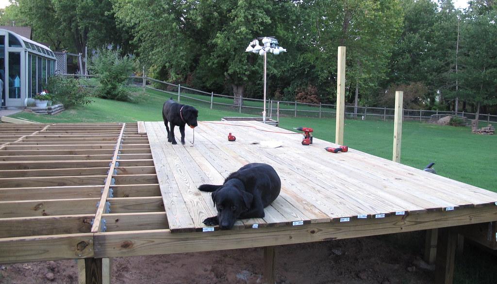 New deck joists and decking boards being framed in a Michigan backyard